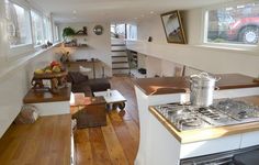 the kitchen is clean and ready to be used as a living room or dining area