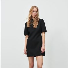 Mini Dress With Round Collar And Short Sleeves. Back Hidden In-Seam Zip Closure. Sleek Short Sleeve Bodycon Dress For Spring, Sleek Black Short Sleeve Dress, Zara Short Sleeve Dresses For Work, Zara Short Sleeve Work Dresses, Zara Short Sleeve Workwear Dresses, Formal Short Sleeve Shift Mini Dress, Sleek Short Sleeve Midi Dress For Spring, Sleek Short Sleeve Mini Dress For Night Out, Chic Mini Length Short Sleeve Dress For Work