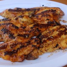 grilled chicken wings on a white plate