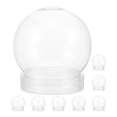 a set of six clear plastic balls on top of each other