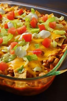 a casserole dish filled with meat, cheese and veggie toppings