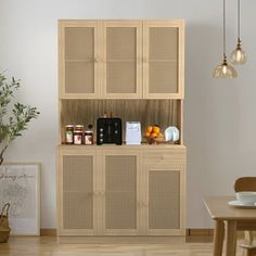 a wooden cabinet sitting next to a dining room table