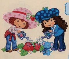 two children are watering strawberries on the ground