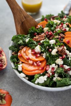 a salad with carrots, feta cheese and pomegranate in a bowl