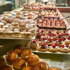 many different types of pastries are on display