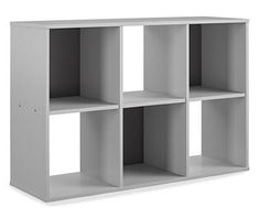 a white bookcase with four sections on the front and one section on the back