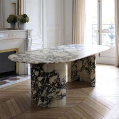 a large marble table sitting in the middle of a room