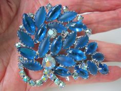 JULIANA HUGE COBALT BLUE Brooch Light Blue Aurora Borealis RHINESTONE 3" VERY NICE CLEAN CONDITION. ALL STONES EXCELLENT. UNSIGNED JULIANA BROOCH IS RHODIUM PLATED WITH PRONG SET GLASS SATIN FINISH AND SHINEY FINISH COBALT STONES AND IRIDESCENT BLUE RHINESTONES. Absolutely stunning! From my personal collection.  Measures and impressive 3 x 2 1/2 inches.  FROM A PET FREE AND SMOKE FREE HOME.   USA SHIPPING: Postage includes tracking and delivery confirmation.  I will ship additional jewelry items for FREE. Blue Brooch, Juliana Jewelry, Blue Aurora, Blue Aurora Borealis, Iridescent Blue, Blue Rhinestones, Aurora Borealis, Cobalt Blue, Satin Finish