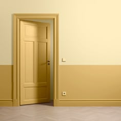 an empty room with a yellow door in it