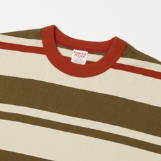 With a truckload of 1960’s charm, we are pleased to welcome the ‘Random Stripe’ tee from Freewheelers & Co. Cut from a supremely soft 100% cotton, this tee is a standard fit, with a cool mid century stripe, and a neat collar finish. The loopwheel construction of the fabric has been designed to ensure the integrity of this tee’s shape, a time honoured production method which has since been overtaken by cheaper modern equivalents. This piece falls under the brand’s ‘Power Wear’ sub-label, which ce 1960's Style, Vintage Sportswear, 2024 Style, Stripe Tee, American West, 1960s Fashion, Grey Khakis, Red And Grey, Clothing Co