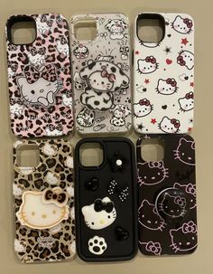 hello kitty phone cases are lined up in a row on a table with the same pattern