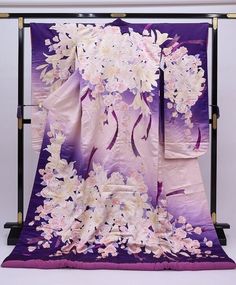 A beautiful wedding Uchikake Kimono with extensive embroidery.  This purple long sleeved Japanese dress is made of high quality silk with floral details.  Enjoy the luxury and quality of Japanese Kimono. Vintage Japanese Kimonos are a unique and stunning piece of Japanese culture. Kimono's are made completely by hand and are considered a wearable work of art. Item: Silk Furisode Kimono Robe No. yukn381 Size: US  L   /  Length  76.7inch (195cm) , Width 26.7inch (68cm) Condition: Used, Very Good.P Purple Kimono Outfit, Wedding Kimono With Floral Embroidery, Purple Kimono Traditional, Long Embroidered Kimono For Wedding, Traditional Pink Kimono For Wedding, Traditional White Kimono For Wedding, Long Floral Embroidered Kimono For Wedding, Traditional Pink Wedding Kimono, Pink Silk Kimono For Wedding