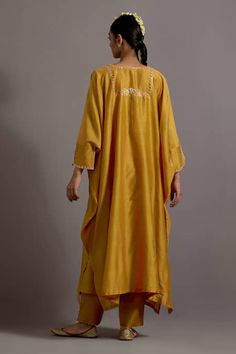 Buy Yellow Chanderi Hand Embroidered Zari Notched Yoke Kaftan With Pant For Women by Deep Thee Online at Aza Fashions. Yellow Raw Silk Palazzo Set With Dabka Work, Yellow Kaftan For Wedding And Festivals, Gold Kaftan With Dabka Detailing, Yellow Long Sleeve Festival Kaftan, Festival Long Sleeve Yellow Kaftan, Yellow Silk Sharara With Dabka, Yellow Silk Sharara With Dabka Details, Yellow Silk Anarkali Set With Dabka Embroidery, Designer Long Sleeve Kaftan With Gota Work