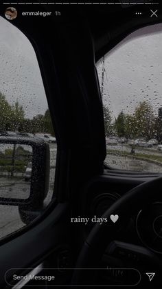 the dashboard of a car with raindrops on it, and another vehicle in the background