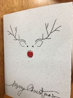 a piece of paper with a drawing of a reindeer's face on it