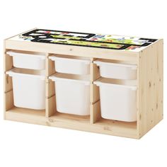 a wooden toy storage unit with four white plastic bins and two black containers on top