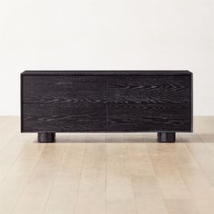 the sideboard is made from black wood