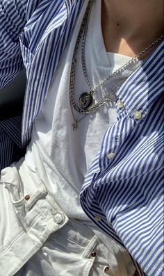 a person wearing a blue and white striped shirt