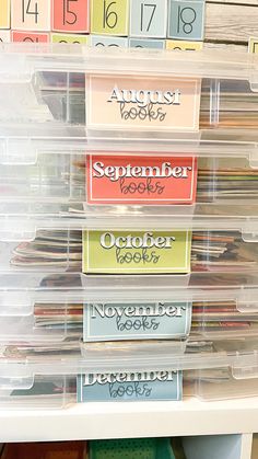 the drawers are filled with many different types of files and folders in plastic bins