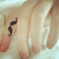 the fingers are decorated with black moustaches