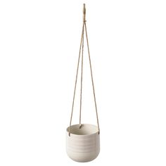 a white hanging planter with rope attached to it