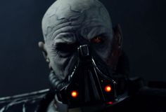 darth vader from star wars the old republic with glowing red eyes and an evil look on his face