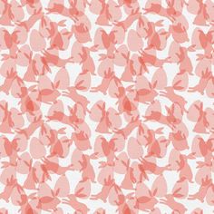 an orange and white background with small pink birds on it's side, in the middle