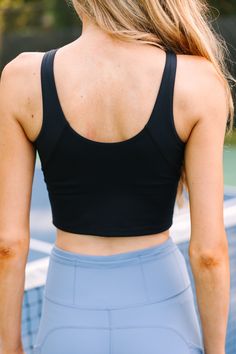 This super soft and stretchy cropped tank is calling on you! It's perfect for any workout routine! It's high neckline gives it good coverage and the built in shelf bra and removable padding make it perfectly customizable for what you are looking for. Round neckline with lower cut back Tank straps Built in shelf bra with removable padding Cropped hemline Generous stretch London is wearing the small. Racerback Crop Top With Built-in Padding For Yoga, Sporty Racerback Crop Top With Built-in Bra, Black Compressive Sleeveless Crop Top, Functional Racerback Crop Top With Medium Support, Functional Medium Support Racerback Crop Top, Cropped Sports Bra With Built-in Bra For Training, Versatile Sleeveless Sports Bra With Built-in Padding, Versatile Sports Bra With Built-in Padding, Black Stretch Tank Top With Built-in Padding