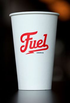 a white cup with the word fuel on it