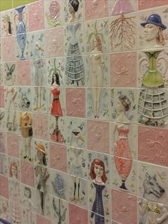 a tiled wall with many different pictures on it