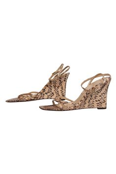 Slip into some slithering style this summer with these wedges from Kate Spade! Made of real snakeskin, these fierce wedges are perfect for bringing some safari chic vibes to your warm weather wardrobe. Pair with a miniskirt and bodysuit for a hot night out and you'll be sure to stun! Size 8 Leather snakeskin upper w/ strappy design Made in Italy Ankle strap closure Snakeskin wedge Leather sole and footbed w/ minor wear Original dustbag included Wedge 3.4" Safari Chic, Chic Vibes, Strappy Wedges, Kate Spade Shoes, Cork Wedge, Snake Skin, Warm Weather, This Summer, Ankle Strap