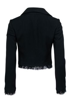 Get ready to rock an edgy look with this black cropped blazer from Dolce & Gabbana. The metallic lace and sequin trim add a touch of glam to the vintage chic design. Double-breasted buttons and lace lining complete this utility blazer. Size 2 (IT 38) Made in Italy Shell 100% Virgin Wool Lining 46% Rayon, 30% Acetate, 4% Elastane, 3% Spandex, 1% Nylon Open front with middle interior button closure Double-breasted buttons Lace trims Bust 34" Waist 30" Shoulder to hem 17.5" Shoulder to shoulder 14. Edgy Fitted Formal Blazer, Edgy Fitted Blazer For Formal Occasions, Black Cropped Evening Blazer, Black Cropped Blazer For Evening, Black Cropped Blazer For Party, Cropped Blazer For Fall Party, Edgy Fitted Blazer For Night Out, Fitted Cropped Jacket For Winter Nights Out, Fitted Cropped Jacket For Night Out In Winter