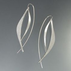 Forged Leaf Earrings by Susan Panciera (Silver Earrings) | Artful Home Modern Silver Earrings With Polished Finish, Silver Earrings With A Modern Twist And Polished Finish, Silver Earrings With Modern Twist And Polished Finish, Silver Earrings With Polished Finish And Modern Twist, Modern Twist Silver Earrings With Polished Finish, Elegant Hand-forged Silver Earrings, Elegant Hand Forged Silver Earrings, Modern White Gold Sterling Silver Wrap Earrings, Modern Hand Forged Sterling Silver Earrings