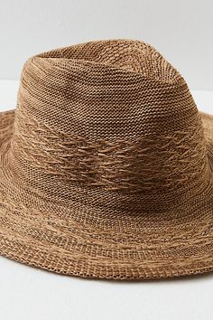 Add an effortless detail to your outfits with this sleek wide brim hat, featured in a packable design so you can look chic anywhere the wind takes you. **Features:** Structured style, packable design, woven fabrication, dipped crown, wide brim **Why We | Arrow Woven Packable Hat by Free People in Brown Trendy Packable Sun Hat With Curved Brim, Chic Packable Sun Hat With Curved Brim, Chic Curved Brim Packable Sun Hat, Chic Sun Hat With Curved Brim And Foldable Design, Chic Packable Brimmed Sun Hat, Packable Brown Hats For Travel, Brown Packable Hat For Travel, Brown Woven Fedora For Travel, Packable Brown Travel Hats