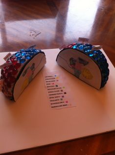 two purses sitting on top of a table