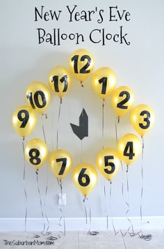 balloons are arranged in the shape of a clock with new year's eve numbers