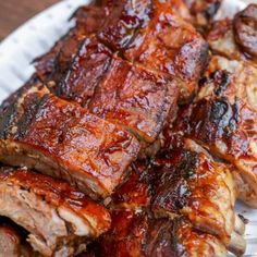 barbecue ribs on a plate with bbq sauce