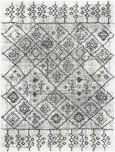 a gray and white rug with an intricate design