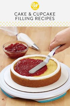 a person is cutting into a cake with a knife on top of it and the words, cake & cupcake filling recipes below