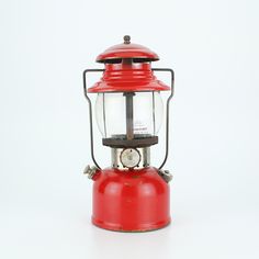 an old fashioned red lantern on a white background