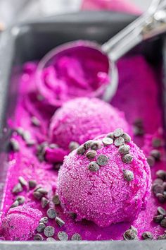 two scoops of purple ice cream with chocolate chips