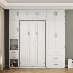 an empty room with white cabinets and drawers