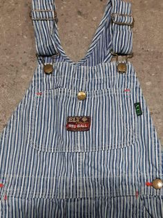 "Kid's vintage 1960s blue and white hickory stripe denim overalls by Ely & Walker 'Red Ball' Sanforized Denim. Made in U.S.A Features single button fly No Tag Approximately sz. 7 (U.S.A Kid's) Measurement taken laying flat: Waist: 13\" Front Rise: 9.5\" Length (from top of bib to hem of leg):40\" Inseam: 22\" Pant legs have been patched from the inside in several spots, as pictured. In otherwise good vintage condition. International Shipping available" Long Overalls, Kids Overalls, Red Ball, Ely, Denim Overalls, Vintage 1960s, Vintage Children, 1960s, Overalls