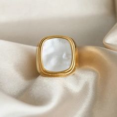 The Pearl Signet Ring combines classic design with a modern twist. Featuring a lustrous pearl set in an 18k gold-plated signet, this ring adds a touch of timeless sophistication and elegance to any outfit. Minimalistic Rings, Magic In The Moonlight, Shell Decorations, Feminine Jewelry, Popular Rings, Shell Ring, Chunky Rings, Take A Walk, 18k Gold Ring