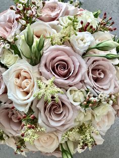 a bridal bouquet with pink and white flowers