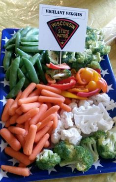 a blue plate topped with vegetables and veggies