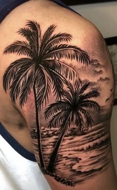 a man with a palm tree tattoo on his shoulder