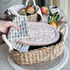 "[About This Handmade Bread Warmer] Looking for a unique and handmade gift for a baker or home entertainer? Check out this bread and tortilla warmer set from Gift Shop BY KORISSA! The set includes a ceramic stone for warming bread and tortillas, and a wicker woven basket. This set makes for a great hostess gift, new home gift, housewarming gift, wedding gift, newlywed gift, anniversary gift, mom birthday gift, or gift for her or him. Perfect for anyone who loves to bake or entertain at home! 🎁 For Add-On Personalized Wooden Gift Tag Options for Gift Box, Click the link below.  https://www.etsy.com/listing/1550716620/personalized-wooden-gift-tag-add-on-gift Our terracotta plate has been engraved with a flower design and cut to fit neatly into a wicker basket. This special bread warmer is n Terracotta Plate, Bread Warmer, Screen Print Tea Towels, Handmade Bread, Oval Basket, Seagrass Basket, Printed Tea Towel, Basket Gift, Dry Well