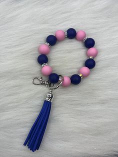 Hi Everyone  Handmade Keychain Wristlet, Blue, Pink  Silicone Beads, Silver Keyring & Clasp, Rhinestone Beads, Blue Long Tassel. The Silicone Beads are 15mm. Handmade jewelry earrings to wear everyday look. Custom made just for you. Handmade Keychain Wristlet are the great jewelry gifts.  Thank you for looking at my pretty earrings jewelry shop. Blue Adjustable Beaded Wristlet, Small Gold Chain, Wire Earrings Handmade, Silver Wire Earrings, Henderson Nevada, Keychain Wristlet, Handmade Keychain, Handmade Jewelry Earrings, Swarovski Beads