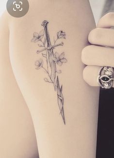 Hadhafang Tattoo, Lord Of The Rings Flowers, Lowkey Tattoos, Narsil Tattoo With Flowers, Lotr Flowers Tattoo, Small Lord Of The Rings Tattoo, Feminine Lotr Tattoo, Shards Of Narsil Tattoo, Lotr Spine Tattoo